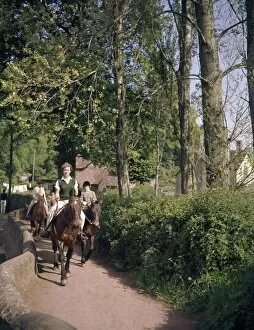 Images Dated 11th April 2017: Women and children riding horses along a country lane