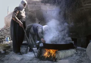 Stew Prints: Two women cooking - near mosque, Uchisar, Cappadocia, Turkey