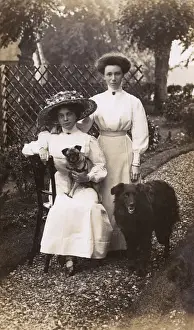 Women with two dogs