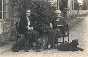 Images Dated 2nd September 2015: Two women and three dogs in a garden