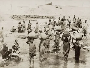 Women filling water pots from the River Nile, Egypt