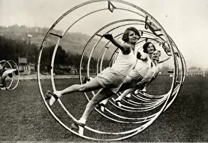 Women in a gymnastic wheel