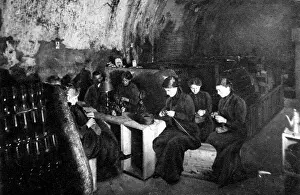 Women knitting in a wine-cellar in a much bombarded Rheims