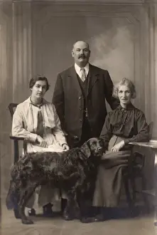 Retriever Prints: Two women and a man with a Flat-Coated Retriever