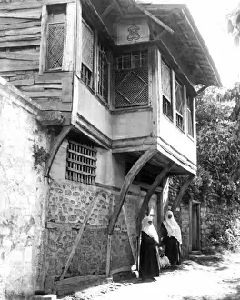 Two women outside house, Turkey