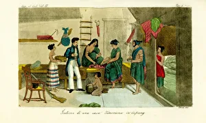 Bamboo Gallery: Women playing congkak in a Timorese house
