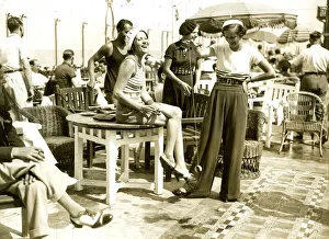 Beret Collection: Women playing with a Yoyo on a beach near Dieppe, France