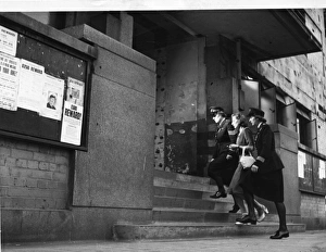 Accompany Gallery: Two women police officers escorting woman, London