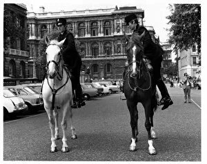 Policewomen Gallery: Two women police officers mounting horses, London