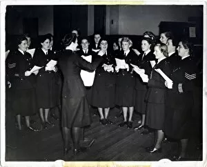 Women police officers singing in choir, Met Police, London