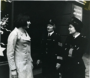 Armbands Gallery: Two women police officers with woman on London street