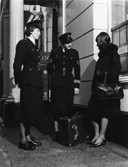 Sleeve Prints: Two women police officers and woman with suitcase