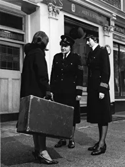 Armbands Gallery: Two women police officers and woman with suitcase