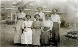 Candid Prints: Five women pose for a group photograph in the garden