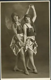 Skirts Prints: Two women pose for a photograph in identical fancy dress costumes