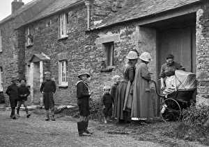 Women and pram in village street