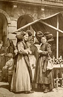 Women out shopping in traditional costume, Alsace, France