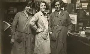 Three women in a small business - wearing overalls