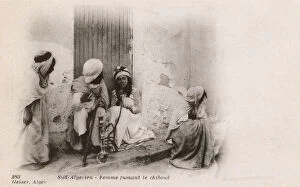 Images Dated 30th May 2018: Women smoking a Chibouk Pipe - Southern Algeria