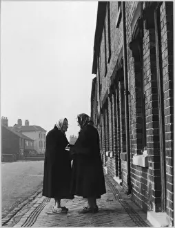 Two Women Talk in Street