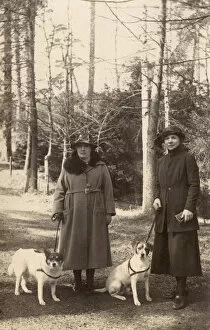 Terrier Collection: Two women out walking with dogs