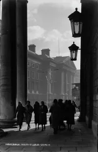 Women Walking Past Trinity College