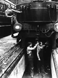 Maintenance Prints: Three women working on a train carriage