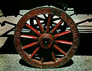 Images Dated 27th April 2021: Wooden spoked wheel on market barrow, London