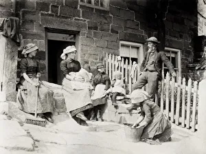 Working family outside cottage Runswick Bay Yorkshire Working family outside cottage Runswick Bay Yorkshire