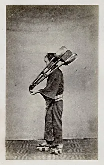 Workman carrying implements, tools, Japan