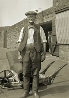 Trouser Prints: Workman standing in a yard