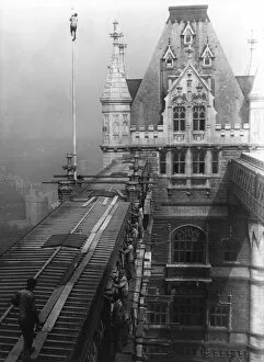 Workmen repairing part of the walkways on Tower Bridge