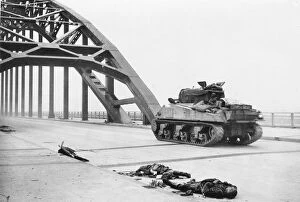 Conveyance Gallery: World War II - British tank crosses bridge Waal river