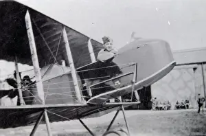 World War One pilot in his aircraft on an airfield