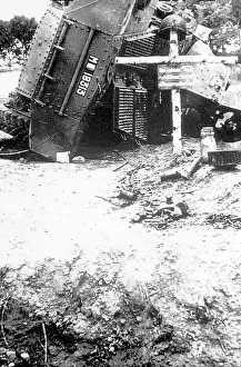 Marked Prints: A wrecked armoured car marked as a war grave