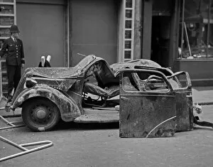 Height Collection: A wrecked car in Howland Street, London