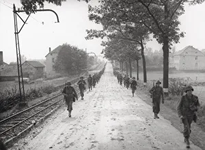 Aachen Prints: WW II 1st US Army marching on the road to Aachen, Germany