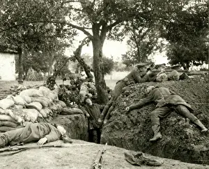 Sandbags Prints: WW1 - British soldiers firing from a captured German trench