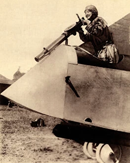 Demonstrates Gallery: WW1 - Lady aviator air-gunner demonstration in aeroplane