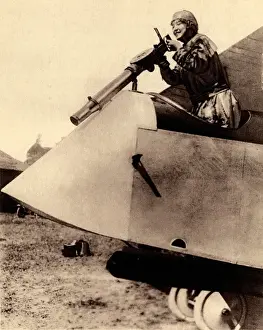 Handling Prints: WW1 - Lady aviator air-gunner demonstration in aeroplane