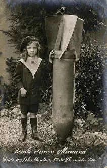 Anger Gallery: WW1 - Small French Child with a huge Unexploded German Bomb