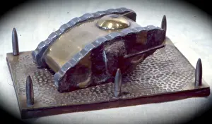 Camouflaged Prints: WW1 tank, camouflaged sides on beaten brass base