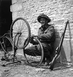 Trooper Prints: WW2 - Canadian Trooper repairing his bicycle in Normandy