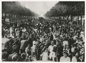 Parisians Prints: WW2 - An enthusiastic crowd of celebrating Parisians fill the Champs Elysees until dawn
