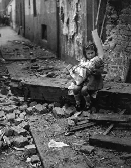 Aftermath Collection: WW2 - Germany - Bombed-out young girl with her doll