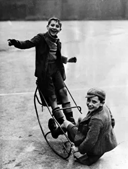 Unaware Collection: WW2 - Home Front - Two boys playing on a see saw