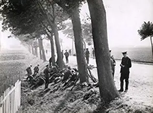 WWI: British Royal Marines resting by roadside near Ostend