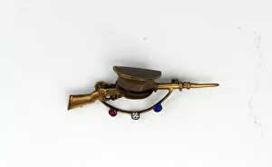 Images Dated 25th September 2012: WWI Sweetheart brooch in the form of a rifle and cap