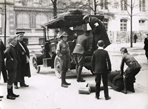 WWI: unloading Red Cross supplies from a car, Paris