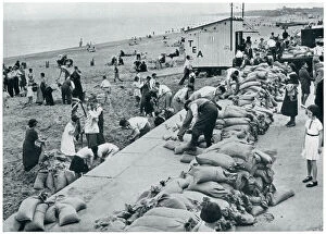 WWII September 1939 Holiday makers filling sandbags